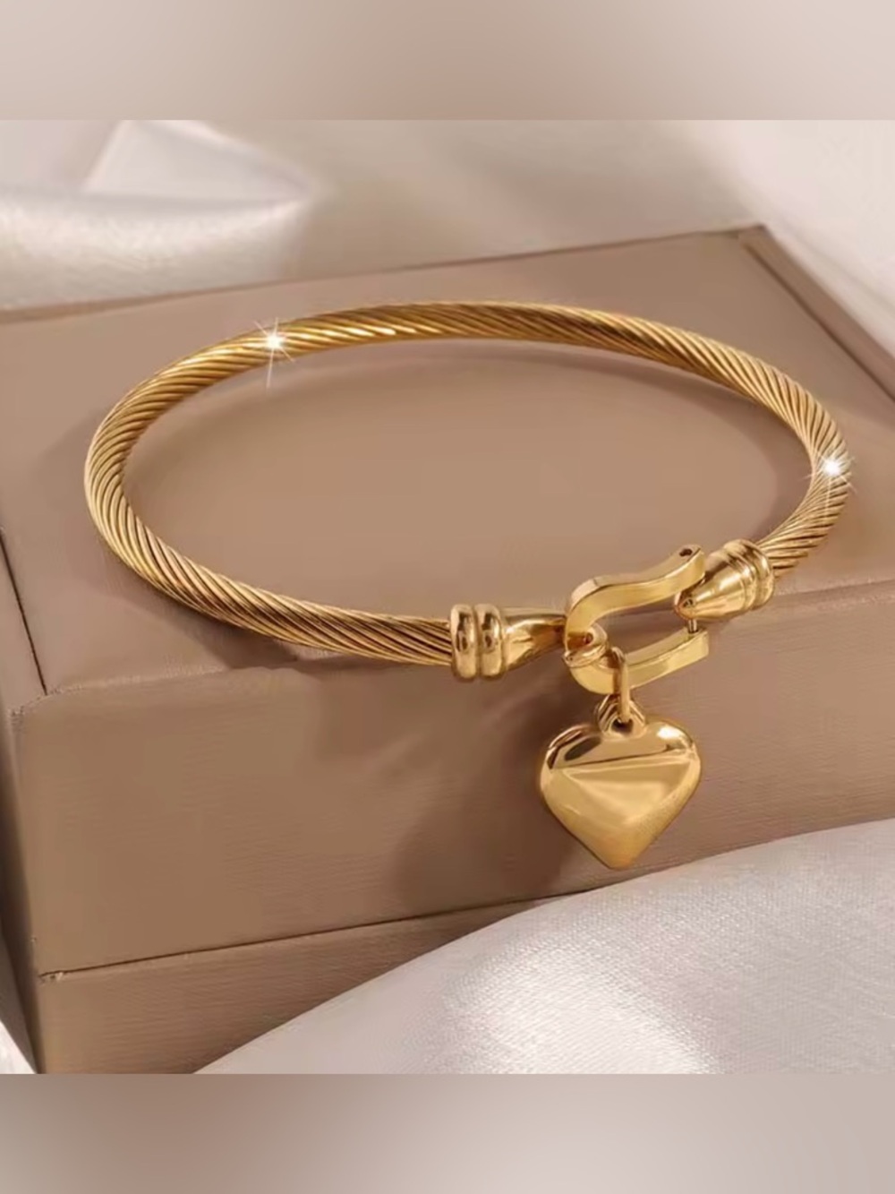Anthropologie Gold-Tone Twisted Cable Bangle with Heart Charm Pendant